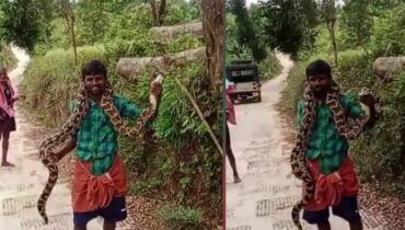 മലമ്പാമ്പിനെ കഴുത്തിലിട്ട് യുവാവിന്റെ അഭ്യാസം; ദൃശ്യങ്ങൾ പുറത്ത്